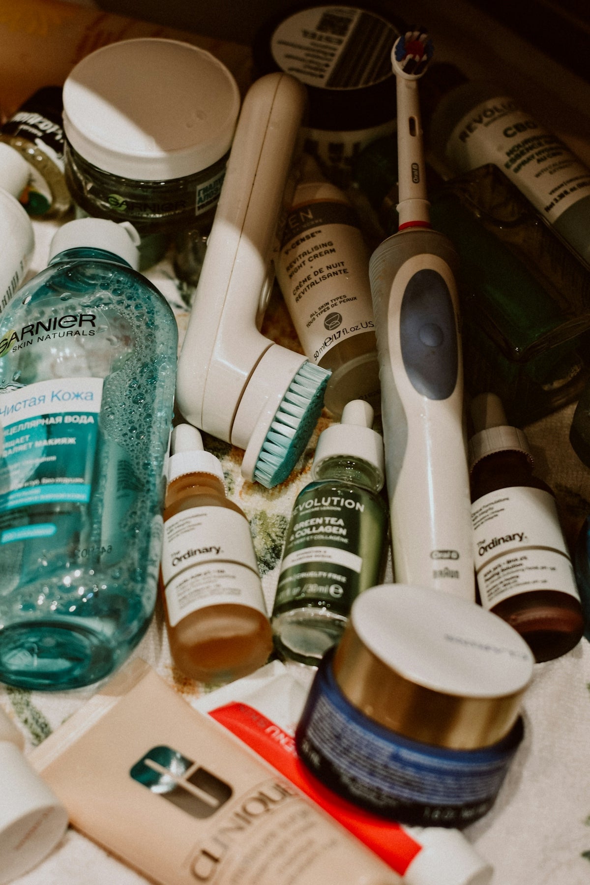Assorted skincare products and an electric toothbrush